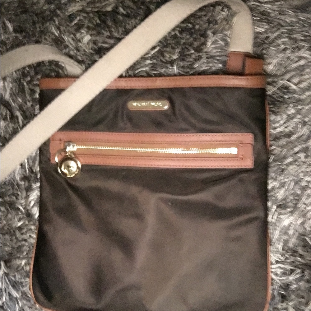 Brown Michael Kors purse w/ gold embellishment
